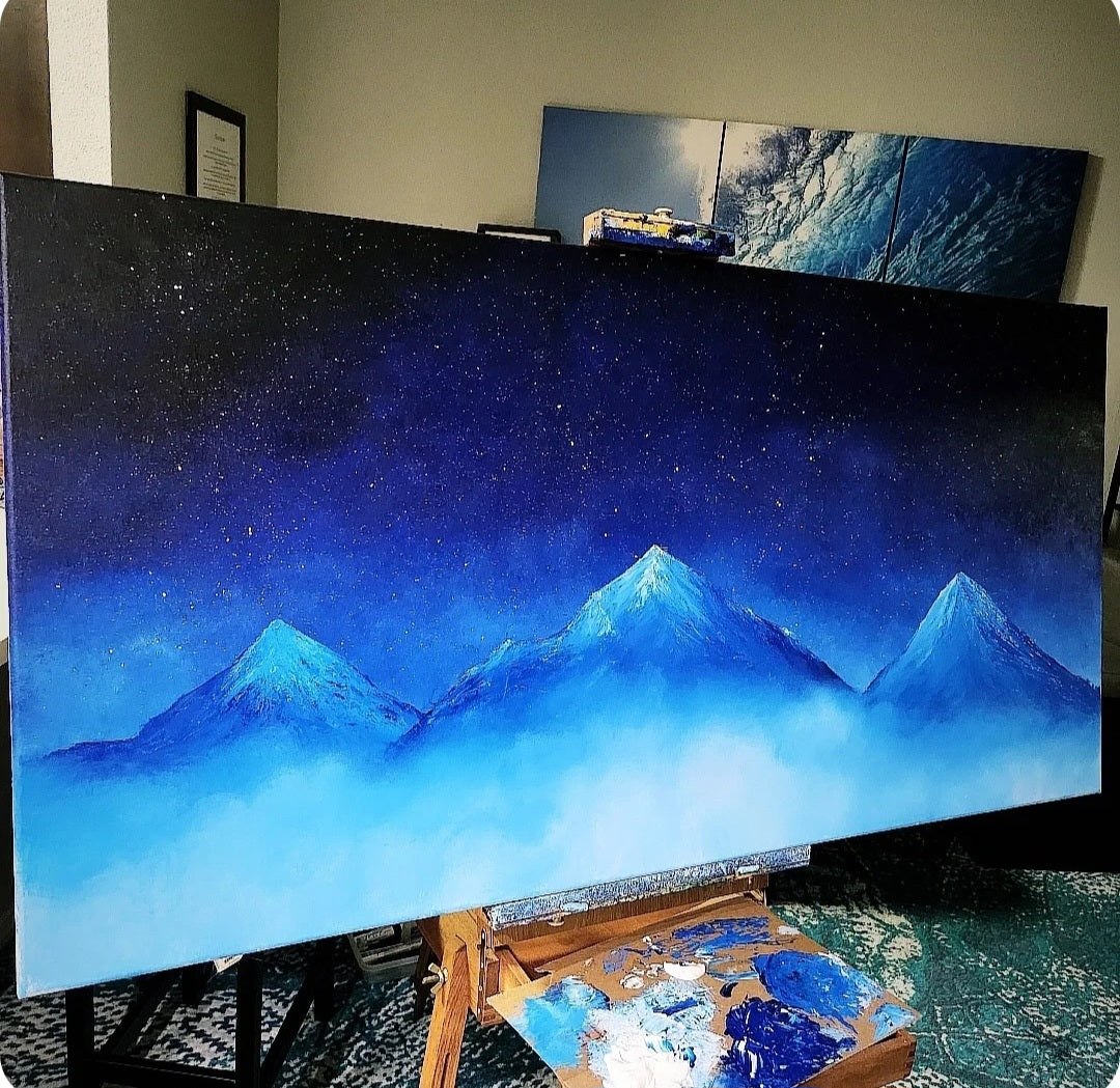 Blue Mountain Original Painting: Large painting of a blue mountain landscape on an easel.