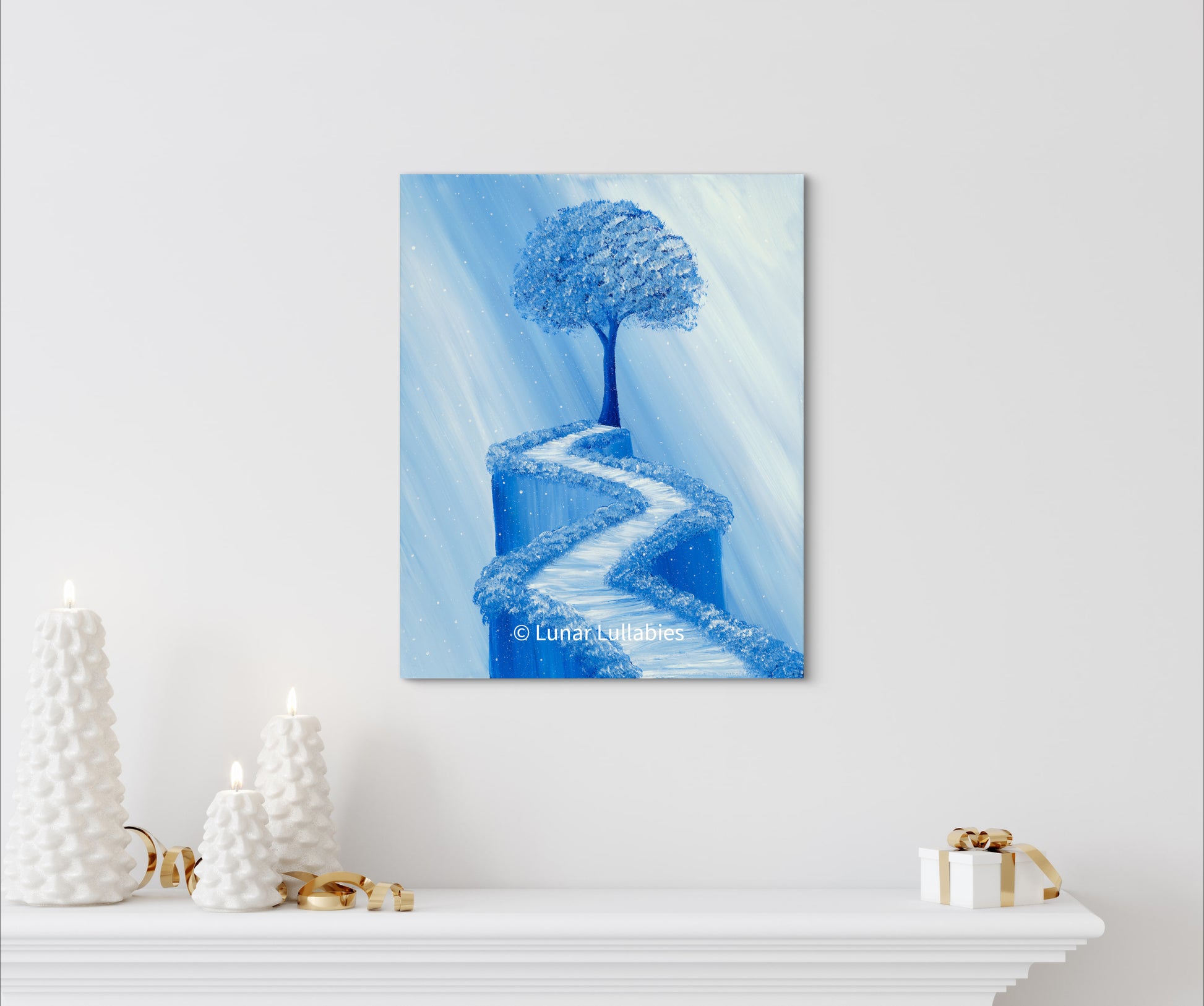 Mockup: Blue painting of a tree and path on a white wall with decorative items below.