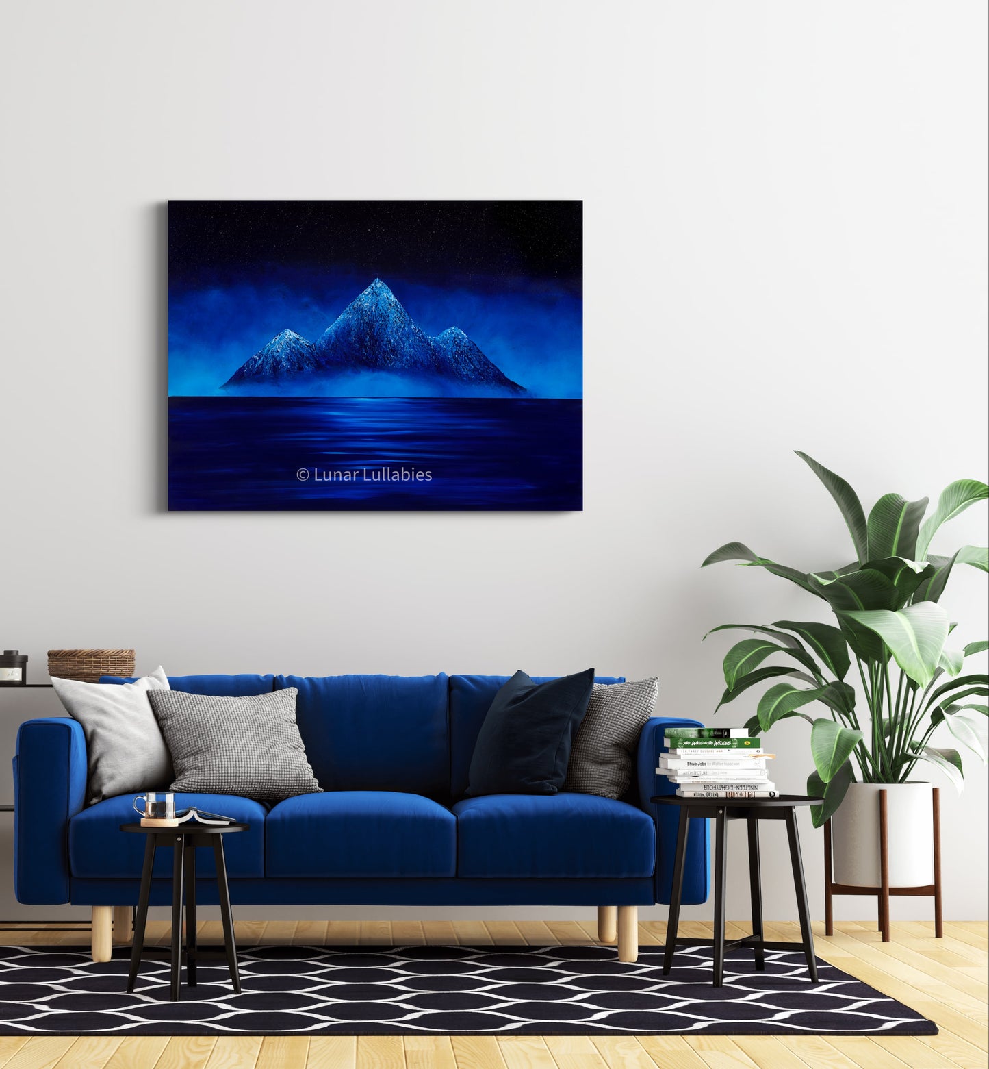 Mockup: Blue mountain landscape painting above a blue sofa in a living room.