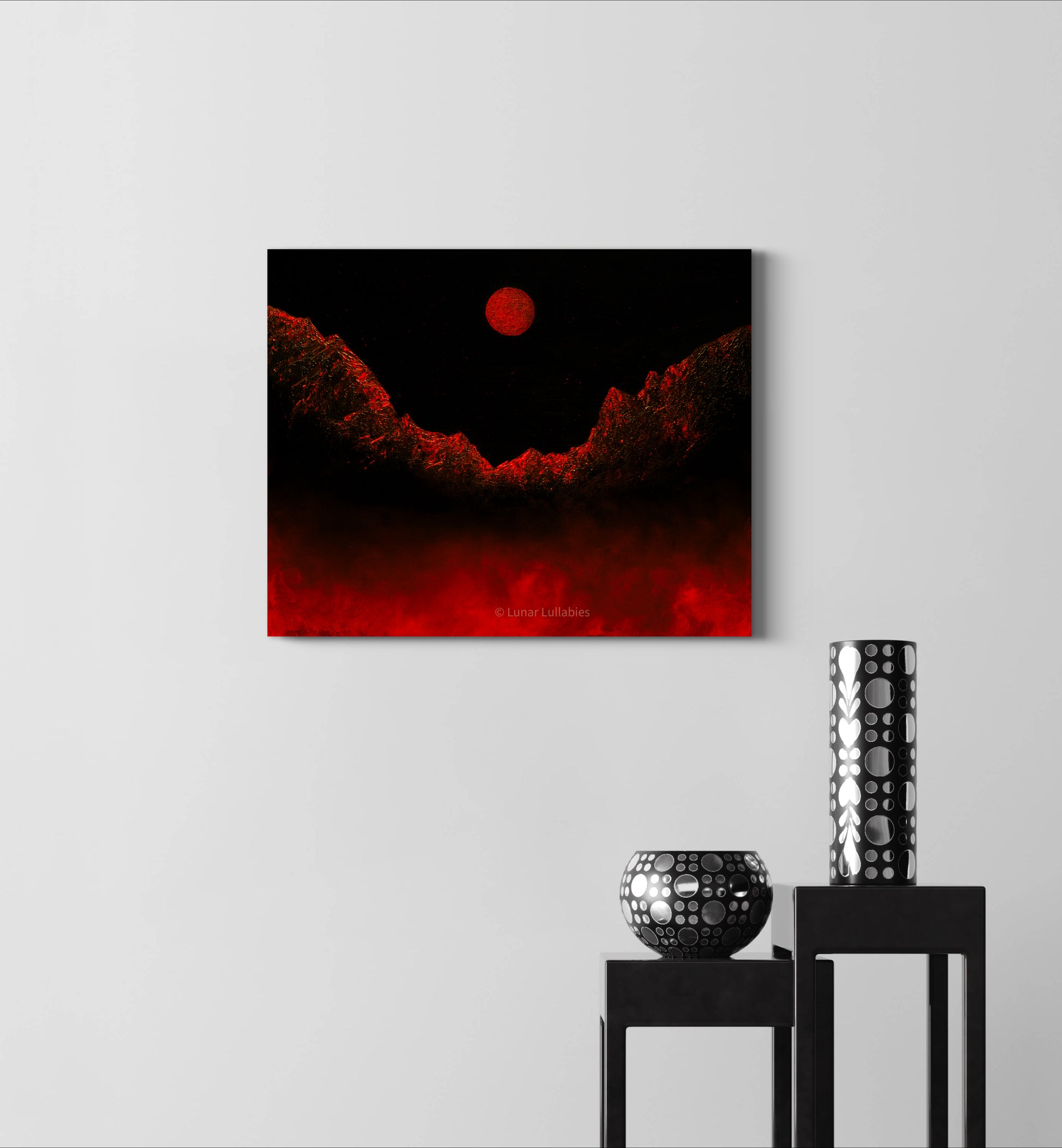 Artwork with red and black colors on a white wall, with two decorative vases below.