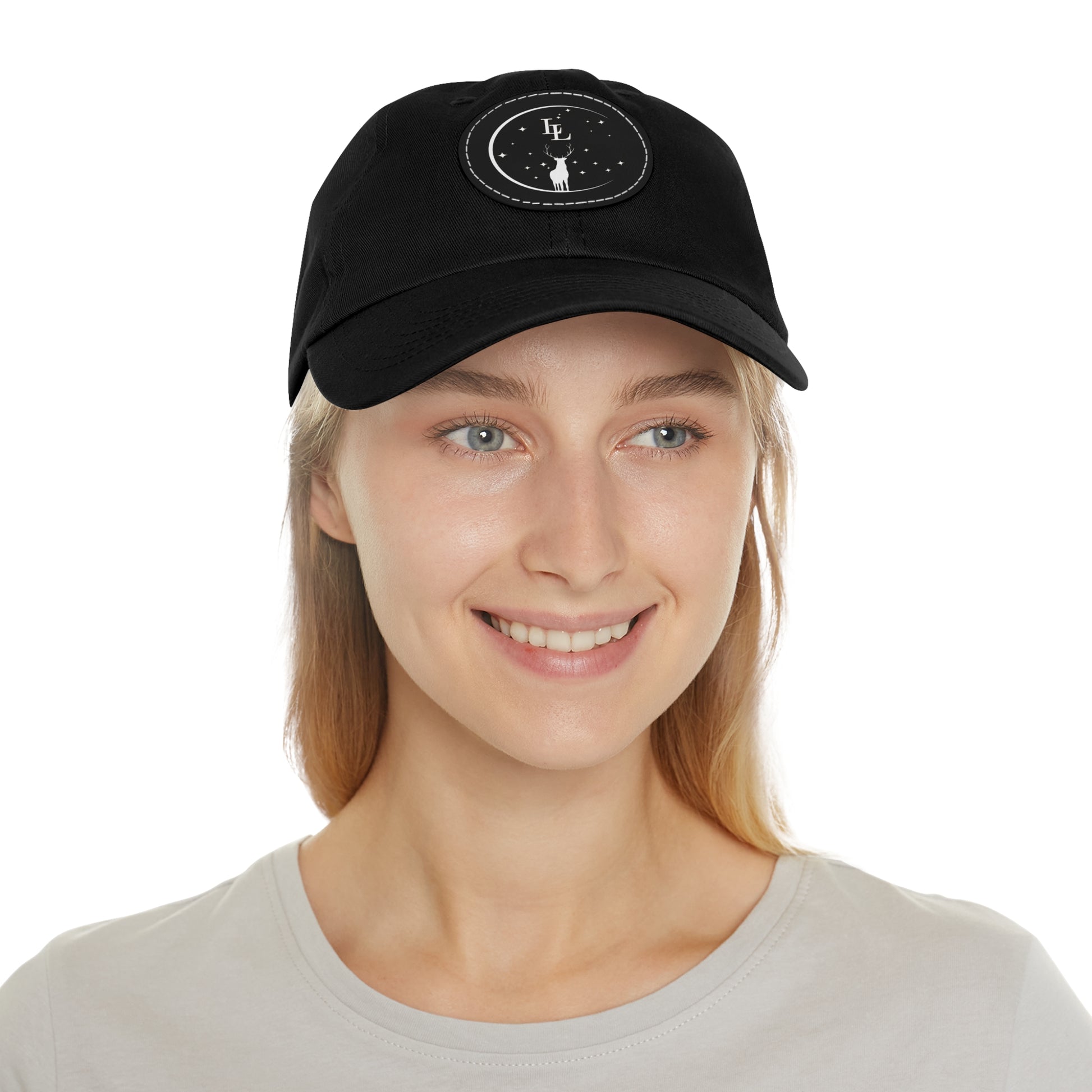 Person wearing a black cap with logo on a white background