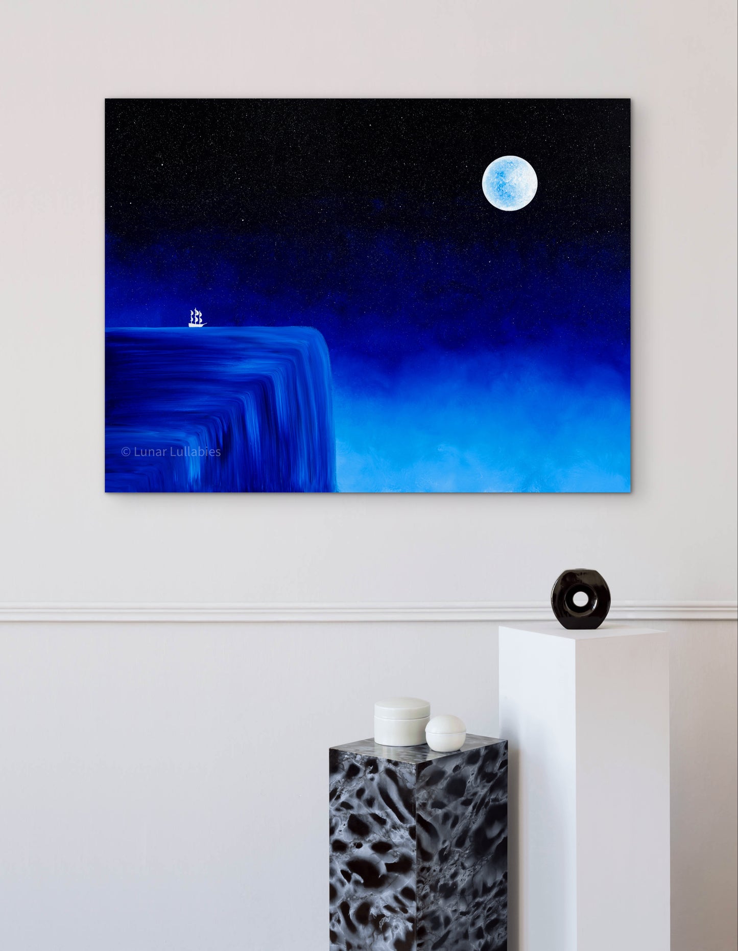 Mockup: A painting of a waterfall and ship on a white wall and other small elements for staging