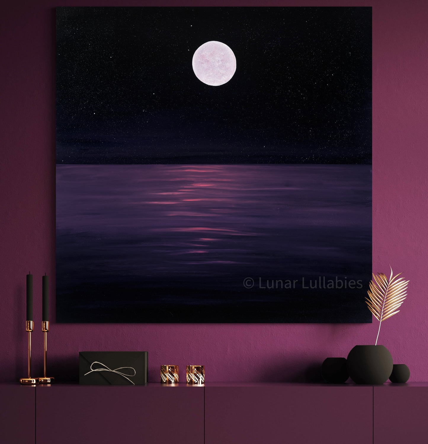Mockup: Canvas print of a moonlit landscape on a purple wall with decorative items below.