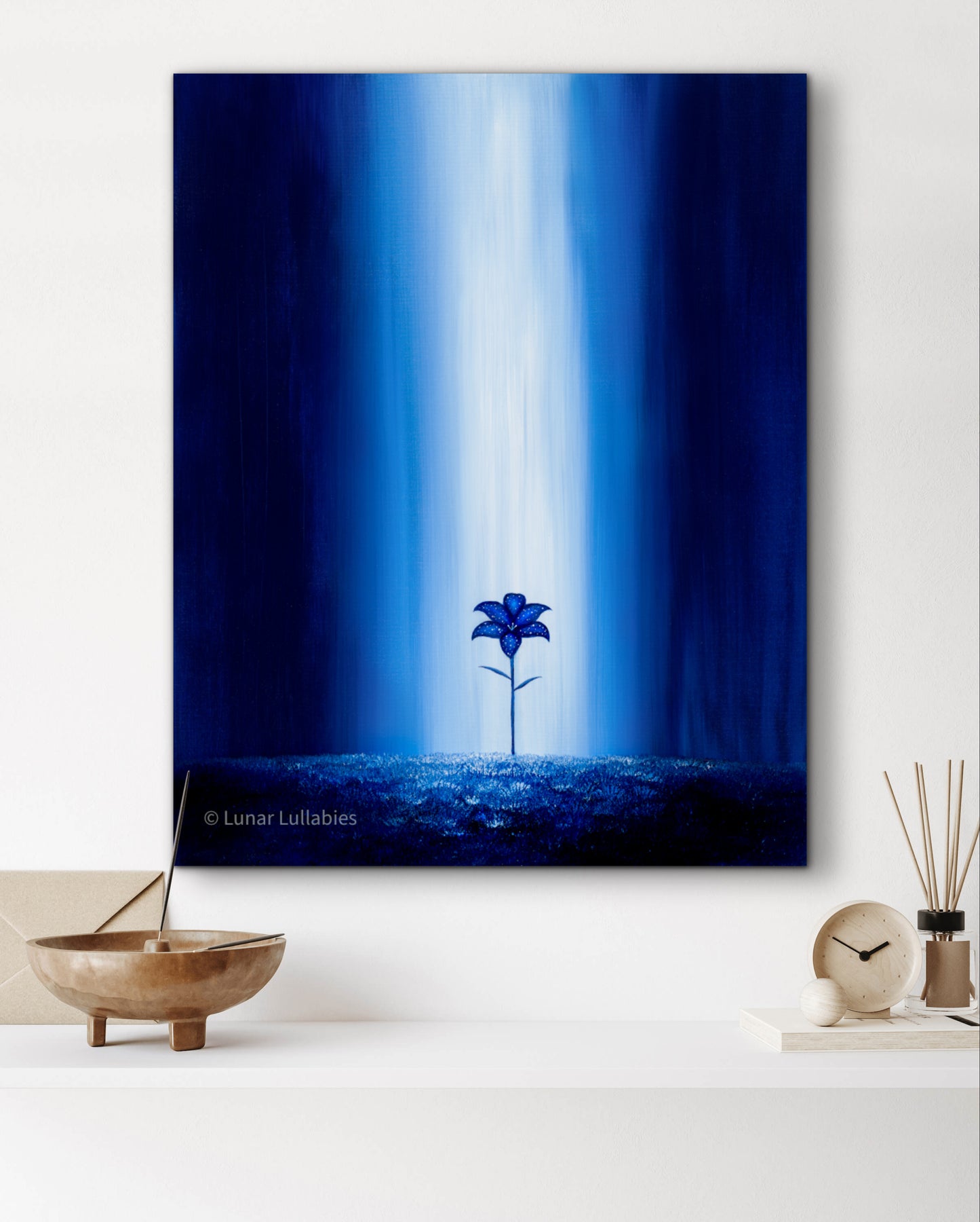 Mockup: Artwork of a blue flower against a blue gradient background in a room setting.