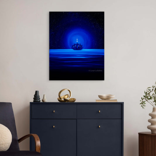 Mockup: Artwork of a blue glowing lotus on the water on a wall above a dark blue cabinet.