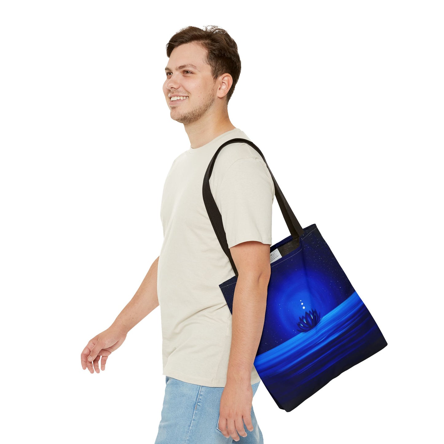 Man carrying a blue tote bag on a white background