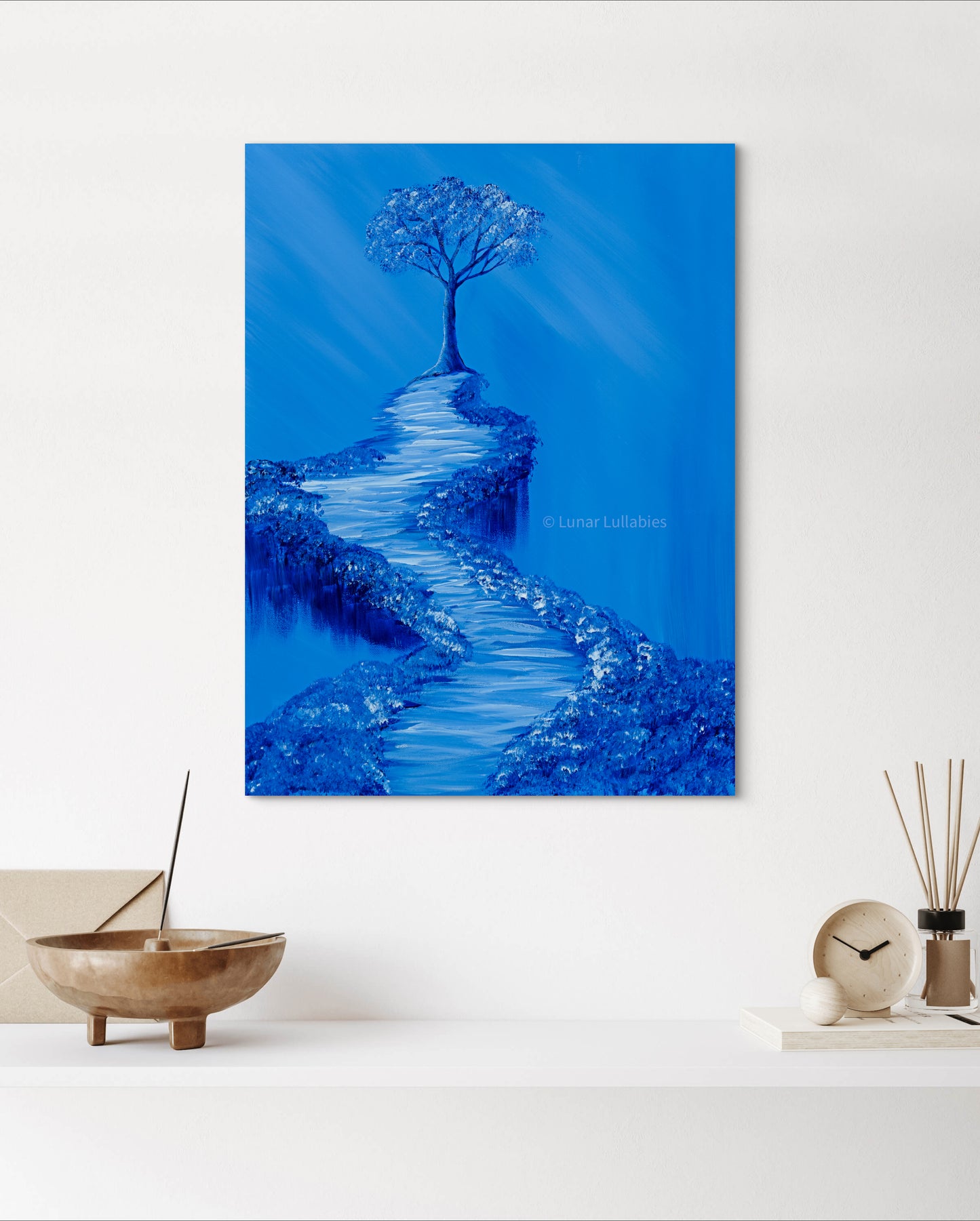Mockup: Blue painting of a tree and path on a white wall