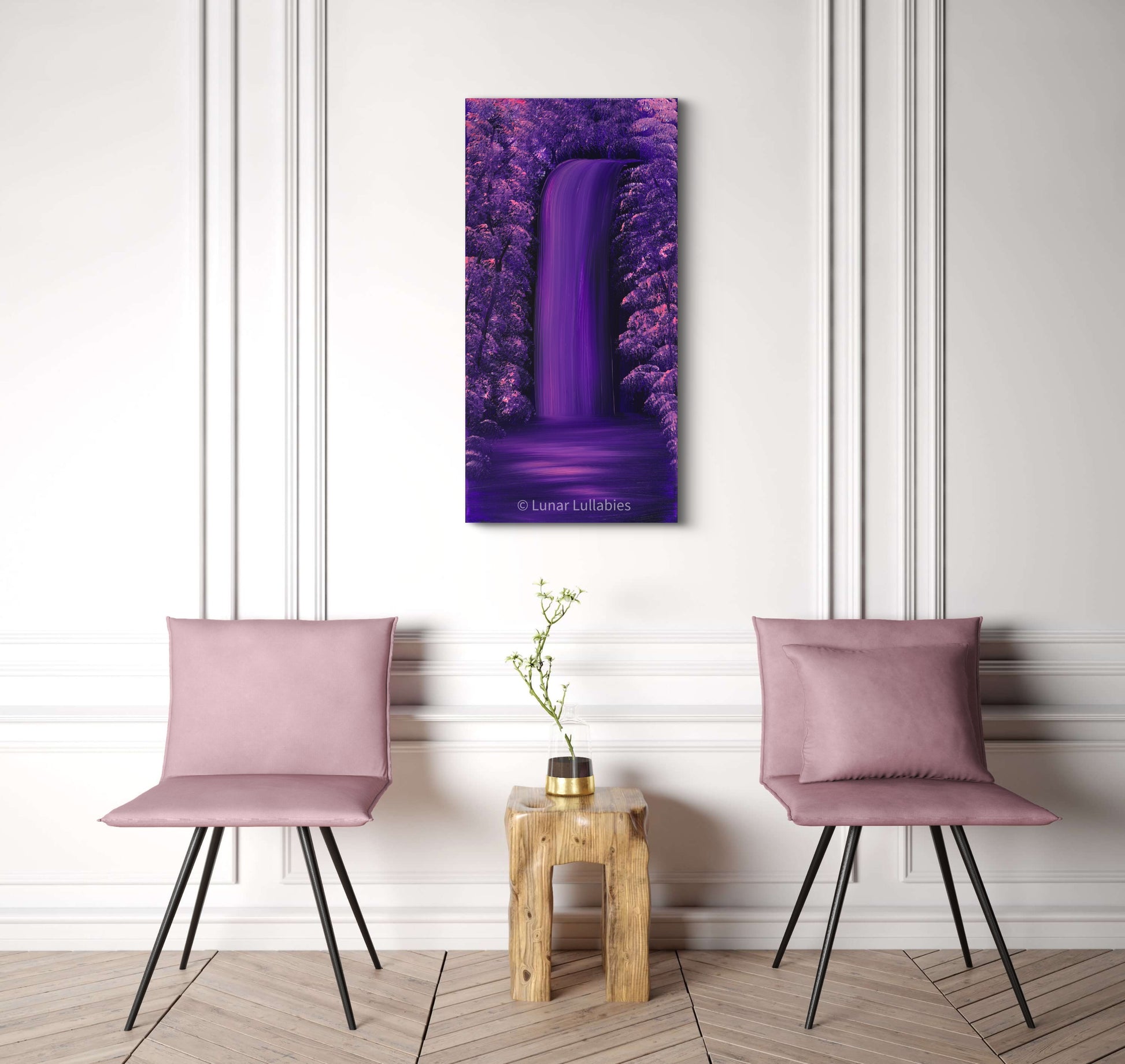 Mockup: Two pink chairs and a small wooden table with a purple painting of a waterfall on a white wall.