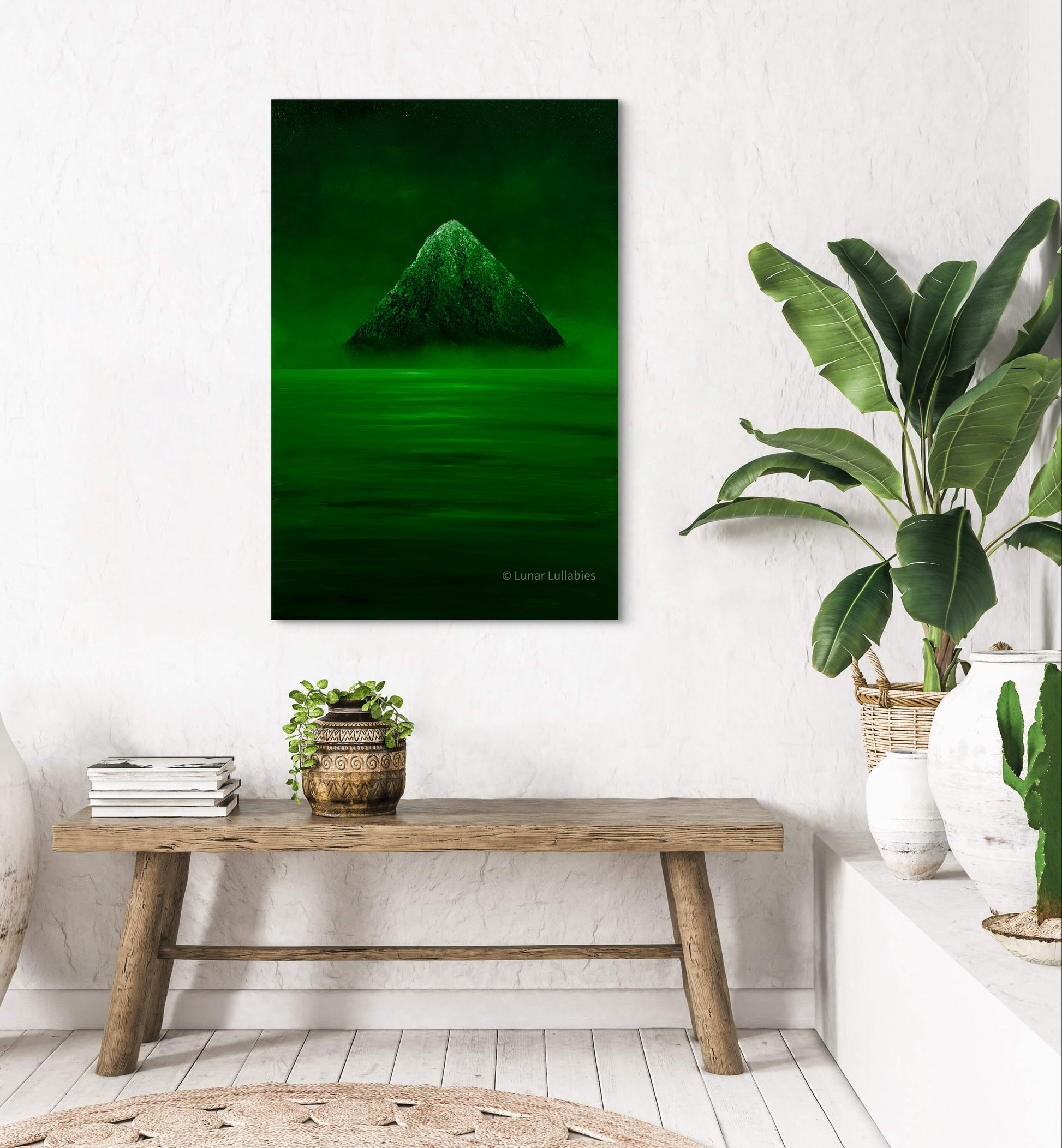 Mockup: Green artwork of a green mountain on a wall above a wooden bench with plants.
